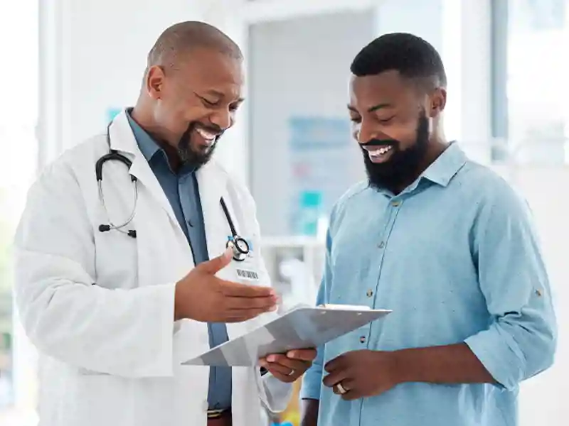 A physician discusses healthcare with a patient